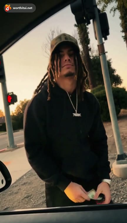 Watermarked Plug Walk preview of the dreads look: the bill hand-off, step back, and wide-stance dance beside the car. Not a customer video.